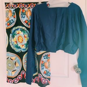 Two piece designer shirt and vibrant skirt.